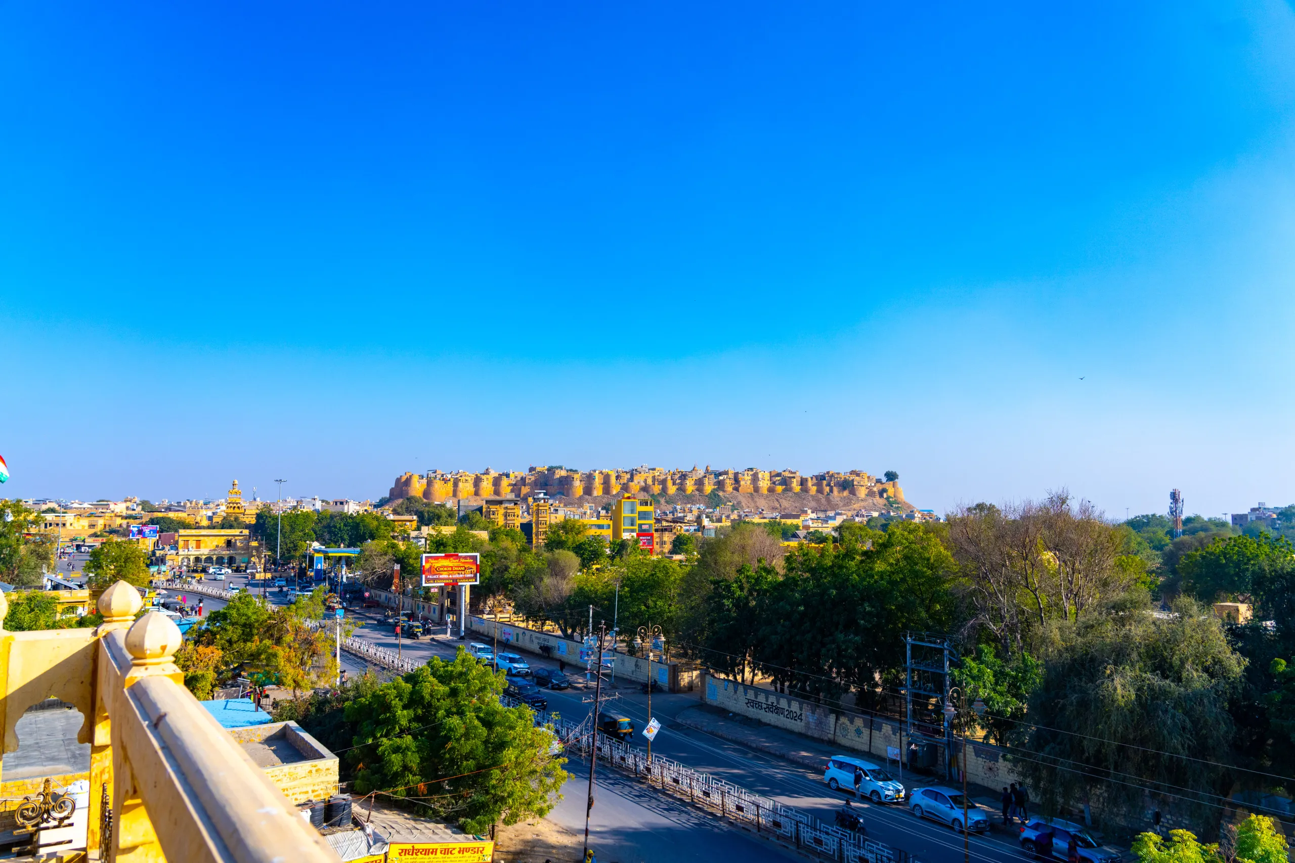 Jaisalmer Fort rising above the city with golden sandstone walls under a clear blue sky