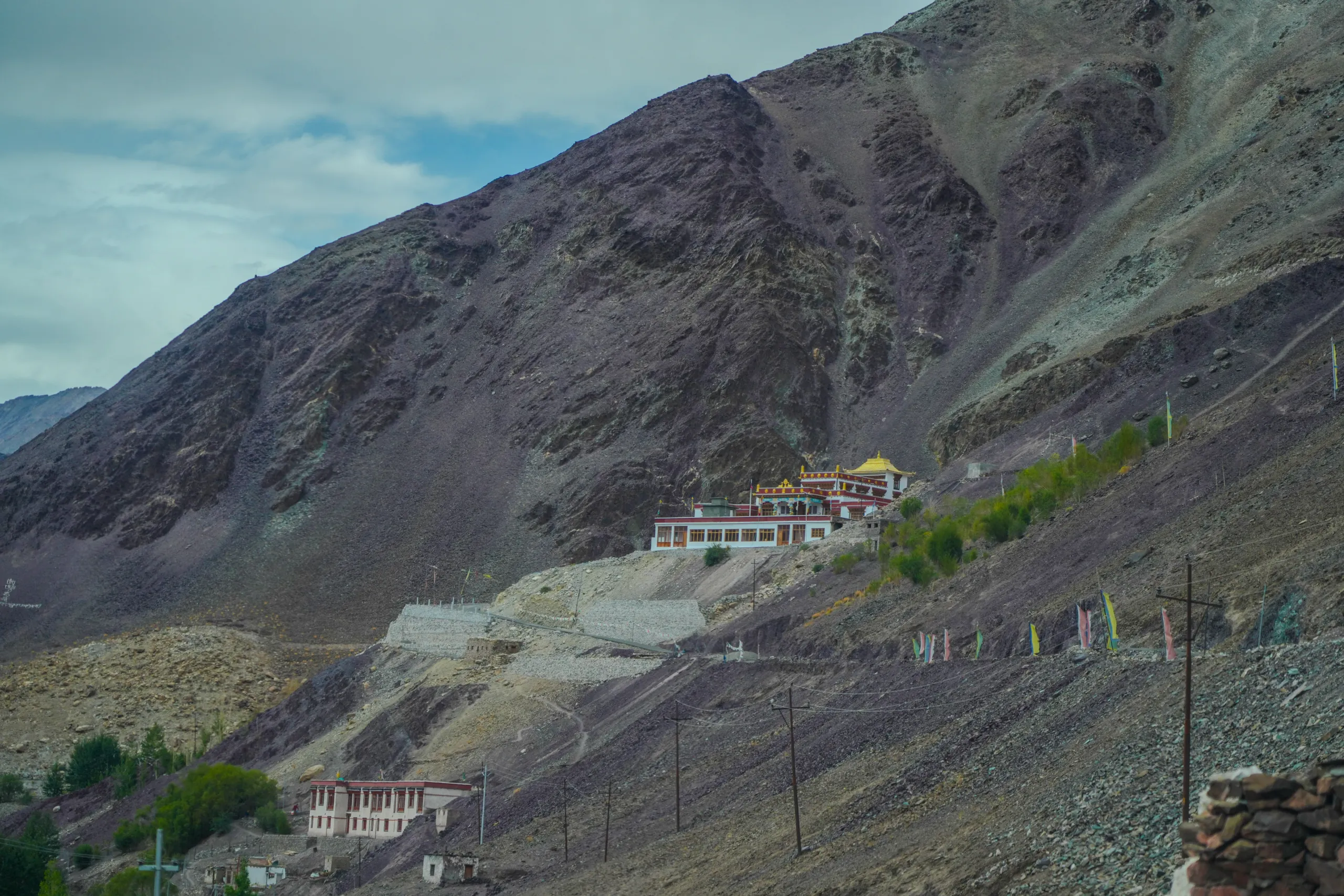 Mountain monastery and Tibetan gompa view on a hillside in Leh Ladakh